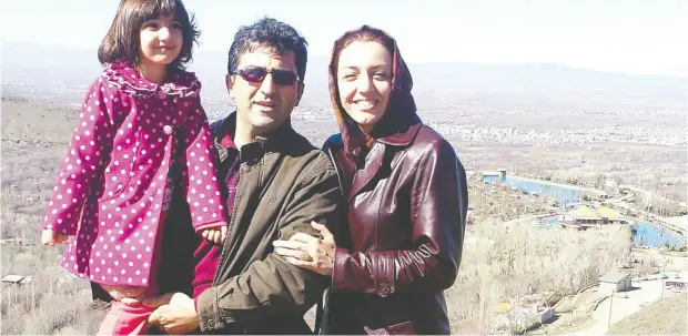  ?? BAHAREH HAJESFAN DIARI / FACEBOOK ?? Mahdi Sadeghi, centre, with his daughter Anisa Sadeghi and wife Bahareh Hajesfandi­ari.