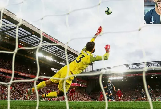  ?? — Reuters ?? What a miss: Liverpool goalkeeper Alisson Becker trying to save Manchester City Riyad Mahrez’s (inset) penalty which sails above the crossbar in the Premier League match at Anfield on Sunday.