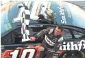  ?? GETTY IMAGES ?? Aric Almirola celebrates after winning the NASCAR Cup Series race at Talladega Superspeed­way on Sunday in Talladega, Ala.