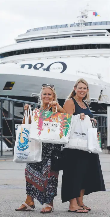  ?? Picture: STEWART McLEAN ?? SHORE SPREE: Rae Patterson and Melinda Taig from Melbourne made the most of their time with some shopping before departing on the Pacific Eden‘s last trip out of Cairns.