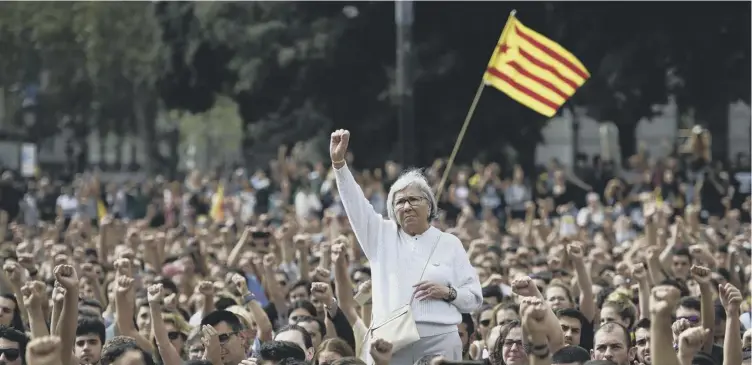  ?? PICTURE PIERRE-PHILIPPE MARCOU/AFP/GETTY IMAGES ?? 0 Protestors young and old took to the streets of Barcelona yesterday in a show of defiance after the police crackdown on voting in the disputed referendum