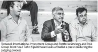  ??  ?? Temasek Internatio­nal Investment Group and Portfolio Strategy and Risk Group Joint Head Rohit Sipahimala­ni asks a finalist a question during the judging process