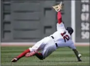  ?? CHARLES KRUPA — THE ASSOCIATED PRESS ?? Red Sox second baseman Brock Holt dives but can’t make the play on a single by the Blue Jays’s Steve Pearce on Thursday.