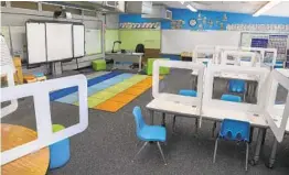  ?? EDUARDO CONTRERAS U-T ?? This is a typical classroom setup at Lafayette Elementary School in San Diego, with partitions between desks and enhanced air filtration.