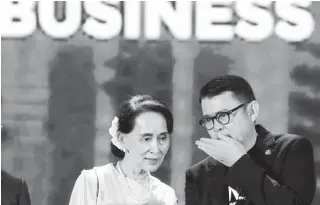  ??  ?? The State Counselor of Myanmar, Aung San Suu Kyi, talks with Jose Ma. Concepcion 3rd, chairman of the Asean Business Advisory Council, after giving her speech durign the Asean Business and Investment Summit 2017 at the Solaire Resort and Casino in...