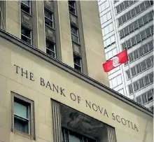  ?? NATHAN DENETTE/THE CANADIAN PRESS ?? The Bank of Nova Scotia building is shown in the financial district in Toronto on Aug. 22, 2017. Scotiabank has signed a deal to buy investment manager Jarislowsk­y Fraser for $950 million.