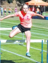  ??  ?? Ava Gaul clears the hurdle.