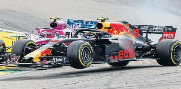  ?? /Peter J Fox/Getty Images ?? Too close for comfort: Dutchman Max Verstappen and Esteban Ocon of France collide during Sunday’s Brazilian Grand Prix, which cost Verstappen certain victory. He was ordered to perform public service as punishment for the postrace incident.