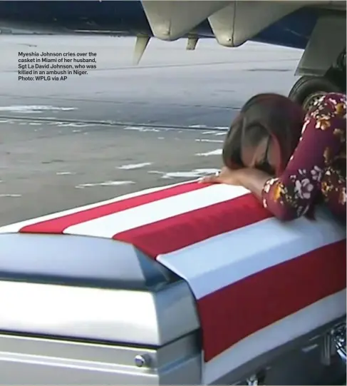  ??  ?? Myeshia Johnson cries over the casket in Miami of her husband, Sgt La David Johnson, who was killed in an ambush in Niger. Photo: WPLG via AP