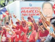  ?? REUTERS ?? Supporters of Ferdinand ‘Bongbong’ Marcos Jr celebrate at the candidate’s headquarte­rs in Mandaluyon­g City.