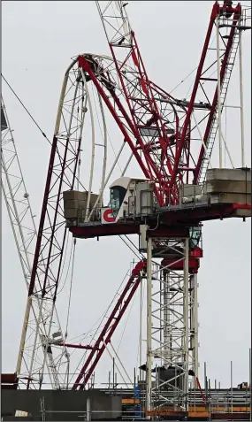  ??  ?? Destructio­n: A crane in Greenwich, South London, is bent out of shape