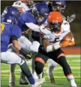  ?? BOB RAINES — DIGITAL FIRST MEDIA ?? Marple Newtown running back Marlon Weathers dekes, ducks and drives for tough yards against the Upper Moreland defense Friday night. Weathers and the Tigers held on for a 24-18 victory.