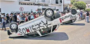  ?? ?? The family of an eight-year-old, mourn her death, above. After her murder, protesters lined the streets of Taxco, left