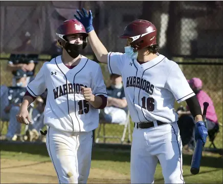  ?? PETE BANNAN — MEDIANEWS GROUP ?? West Chester Henderson’s Dean O’Neill (16) congratula­tes Kevin Wheeler after Wheeler scored in the first inning of a game against Malvern Prep on Friday.