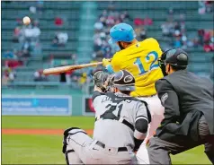  ?? MARY SCHWALM/ AP PHOTO ?? Marwin Gonzalez of the Boston
Red Sox hits a solo home run during the eighth inning Saturday against the Chicago White Sox in Boston. Gonzalez’ hit broke a 3-3 tie. Boston won the game 7-4 and will play a doublehead­er today against the White Sox.