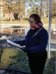  ?? PROVIDED PHOTO ?? DAR Regent Heather Mabee reads an account of the lives lost and sacrifices made by American soldiers and sailors at Pearl Harbor on Dec. 7, 1941.