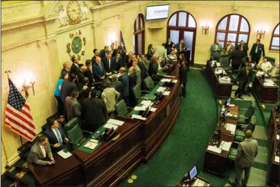  ?? The Associated Press ?? POLITICAL UNCERTAINT­Y: Puerto Rico’s House of Representa­tives prepare to vote on whether to confirm Pedro Pierluisi as secretary of state on Friday in San Juan, Puerto Rico. The confirmati­on removes an important obstacle to him becoming governor. But Pierluisi’s fate remains unclear.