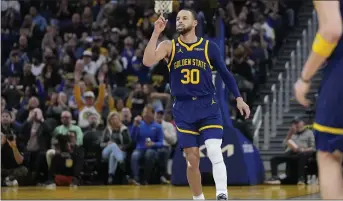  ?? JEFF CHIU — THE ASSOCIATED PRESS ?? Golden State Warriors guard Stephen Curry (30) gestures after scoring against the Dallas Mavericks during the second half of an NBA basketball game in San Francisco, Saturday, Feb. 4, 2023.