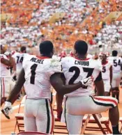  ?? PHOTO COURTESY OF RADI NABULSI/UGASPORTS.COM ?? Georgia senior running backs Sony Michel and Nick Chubb talk on the sideline during the 41-0 win at Tennessee on Sept. 30.