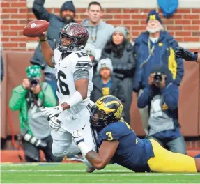  ?? WINSLOW TOWNSON/USA TODAY SPORTS ?? Last year, Michigan’s Rashan Gary sacked Ohio State quarterbac­k J.T. Barrett in the first half, but the Buckeyes won 31-20.