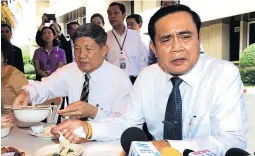  ??  ?? Gen Prayut Chano-cha has a casual lunch chat with reporters covering topics ranging from his favourite movie to his tenure in politics.