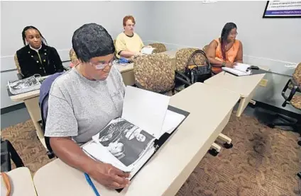  ?? KENNETH K. LAM/BALTIMORE SUN ?? Labrea Cherry, from left, Felicia Jones, Charles Shaw and Asia Thomas are some of the participan­ts in a retail training certificat­ion class at Goodwill. The class will guarantee job interviews for those who complete the training.