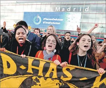  ?? FERNANDO VILLAR EPA/Shuttersto­ck ?? ENVIRONMEN­TAL activists march in Madrid this month. This year’s talks aimed to f lesh out Article 6 of the 2015 Paris agreement, which allows carbon trading to be used in meeting emissions targets.