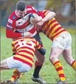  ?? FM4587716, left; FM4587722 ?? Left, Maidstone’s Craig Webb held up by Chobham. Right, team-mate Ben Williams tries to wrestle free