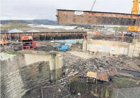  ??  ?? Going up Massive girders taken away during bridge demolition