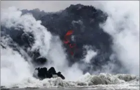  ?? JAE C. HONG — THE ASSOCIATED PRESS ?? Lava flows into the ocean near Pahoa, Hawaii. on May 18.