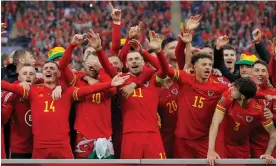  ?? Photograph: Tom Jenkins/The Guardian ?? The Wales players celebrate after winning their playoff final against Ukraine to seal their place at the Qatar World Cup.