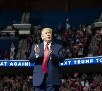  ?? Doug Mills/The New York Times ?? President Donald Trump takes the stage at the BOK Center in Tulsa, Okla., over the weekend.