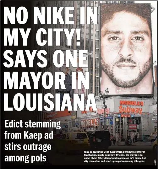  ??  ?? Nike ad featuring Colin Kaepernick dominates corner in Manhattan. In city near New Orleans, the mayor is so upset about Nike’s Kaepernick campaign he’s banned all city recreation and sports groups from using Nike gear.