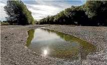  ?? PHOTO: JOHN KIRK-ANDERSON/STUFF ?? A scummy pond was all that was left of the Selwyn River at Chamberlai­ns Ford over summer.