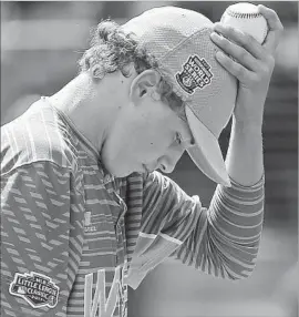  ?? Gene J. Puskar Associated Press ?? RANCHO SANTA MARGARITA pitcher Drew Rutter collects himself after giving up a grand slam to Greenville at the Little League World Series.