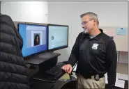  ?? MACOMB DAILY STAFF PHOTO ?? Shelby Township Det. Ron Weiss is pictured on the job at the department Tuesday.