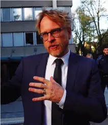  ??  ?? Andre Marty, spokesman for the Swiss attorney general in front of the office where Al-Khelaifi was questioned. (Reuters)