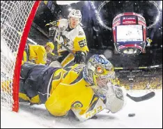  ?? BRUCE BENNETT / GETTY IMAGES ?? Predators goalie Pekka Rinne makes a glove save against Jake Guentzel in Monday’s Game 4, which Nashville won 4-1 to even the series at 2.