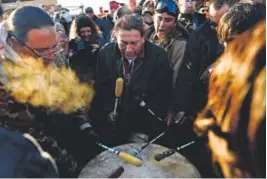  ??  ?? American Indians play drums to celebrate after Sioux Chief Arvol Looking Horse announced that the U.S. Army Corps of Engineers will no longer grant access to the Dakota Access Pipeline. Helen H. Richardson, The Denver Post