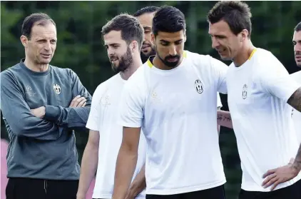  ??  ?? Juventus coach Allegri watching his players during yesterday’s training spin