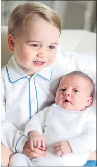  ??  ?? CUDDLES: Prince George and sister Charlotte