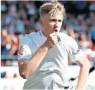  ??  ?? Cool head: Tommy Doyle celebrates scoring a match-winning penalty