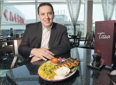  ??  ?? DAN JANISSE/THE Windsor Star The Taza Mediterran­ean Grill is now part of Caesars Windsor. Abe Taqtaq, owner of the restaurant, shows off some of the Lebanese food on the menu on Tuesday.
