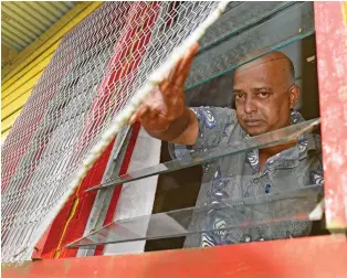  ?? Photo: Ronald Kumar ?? Shree Satya Sanatan Dharam Ramayan Mandali (temple) President, Janen Prasad, shows the window that was forced open to gain entry to the temple in Waila, Nausori.