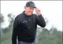  ?? ROB CARR / GETTY IMAGES / AFP ?? Phil Mickelson smiles at the gallery on the 18th green during Thursday’s opening round of the Masters in Augusta, Georgia.