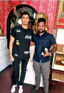  ?? ?? Arjun the cricket fan: With leading batsman Charith Asalanka