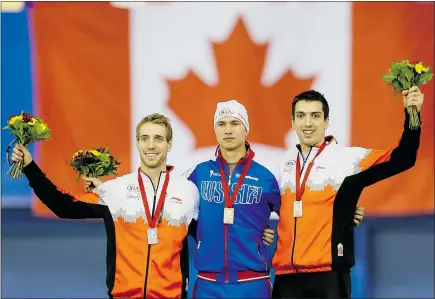  ?? — THE CANADIAN PRESS ?? Canada’s William Dutton, left, who won silver, gold-medallist Pavel Kulizhniko­v of Russia and Canada’s Alex Boisvert-Lacroix share the podium after a World Cup speedskati­ng event.