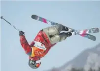  ?? Cameron Spencer, Getty Images ?? Cassie Sharpe of Canada twists and turns in a gold medalwinni­ng performanc­e in the women’s freestyle skiing halfpipe event Tuesday.