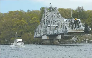  ?? DANA JENSEN/THE DAY ?? A boat moves through the East Haddam Swing Bridge Wednesday on the Connecticu­t River.