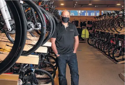  ?? RYAN TAPLIN • THE CHRONICLE HERALD ?? Andrew Feenstra, owner of Cyclesmith, at his shop on Agricola Street in Halifax on Thursday.